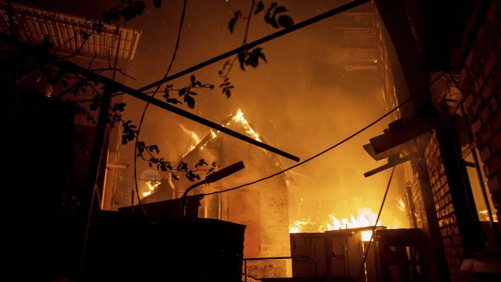 A house burns after a Russian attack in Kherson, Ukraine on Saturday, Dec. 3, 2022.