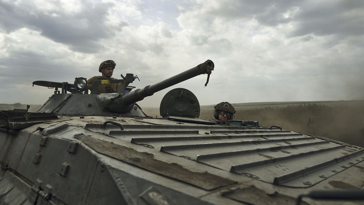 Soldiers of Ukraine's 3rd Separate Assault Brigade ride in an armored personnel carrier near Bakhmut, the site of fierce battles with the Russian forces in the Donetsk region, Ukraine, Monday, Sept. 4, 2023. (AP Photo/Libkos, File)