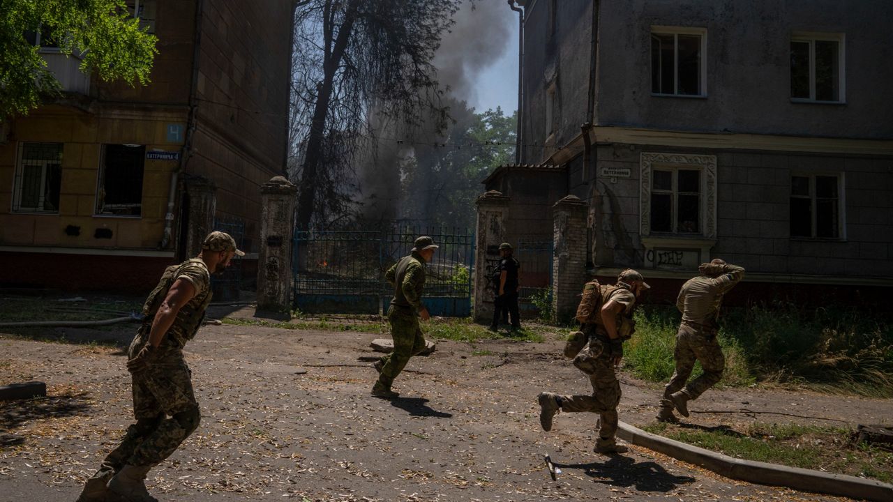 Ukrainian soldiers run after a missile strike hit a residential area in Kramatorsk, Ukraine, on Thursday. (AP Photo/Nariman El-Mofty, File)