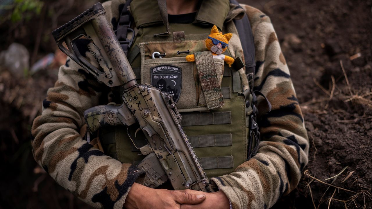 Zhenia, a member of the Ukrainian territorial defence force, guards a position near Kutuzivka, east Ukraine, Friday, May 13, 2022. (AP Photo/Bernat Armangue)