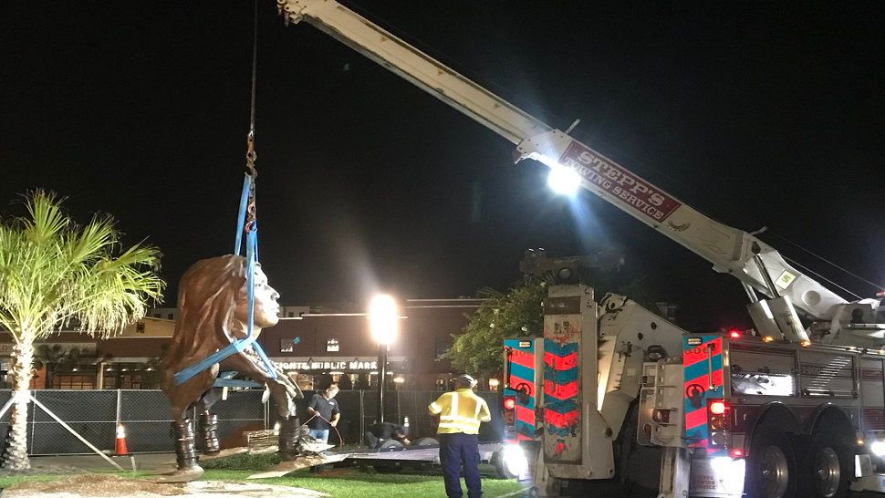 The Ulele statue was removed early Tuesday, Sept. 18. 2018, from its position near Ulele Restaurant on the Tampa Riverwalk. 