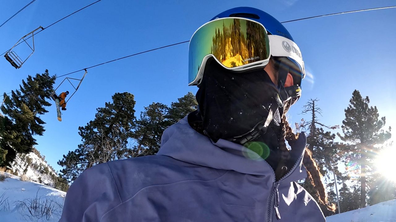 Siddhartha Ullah cruises down the snow covered runs at Mountain High. (Spectrum News/Jo Kwon)