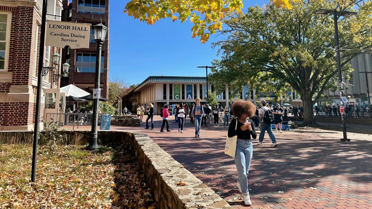 Students walk through the quad outside the student union at UNC-Chapel Hill on Monday, Oct. 24, 2022. The U.S. Supreme Court will hear a case Monday, Oct. 31, over the university's consideration of race in the admissions process. (AP Photo/Hannah Schoenbaum)