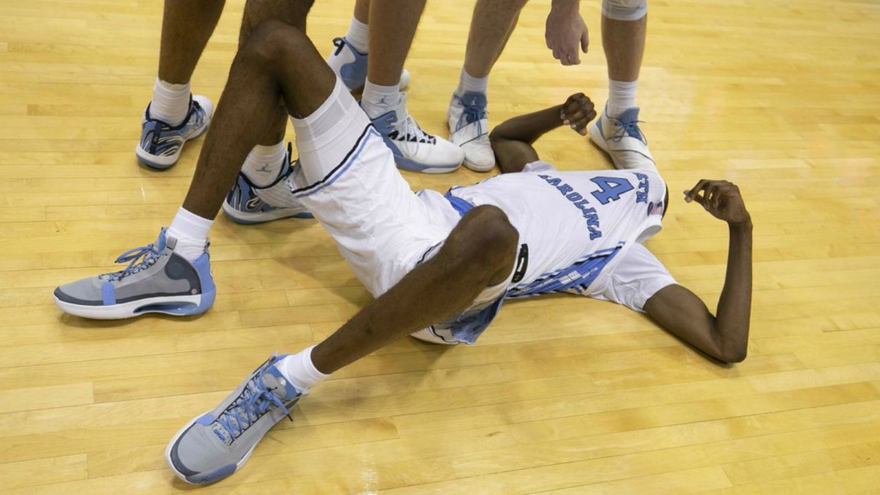 North Carolina's Brandon Robinson (4) coves his face after missing a final three-point attempt in overtime in an NCAA college basketball game against Clemson on Saturday, Jan. 11, 2020, at the Smith Center in Chapel Hill, N.C.