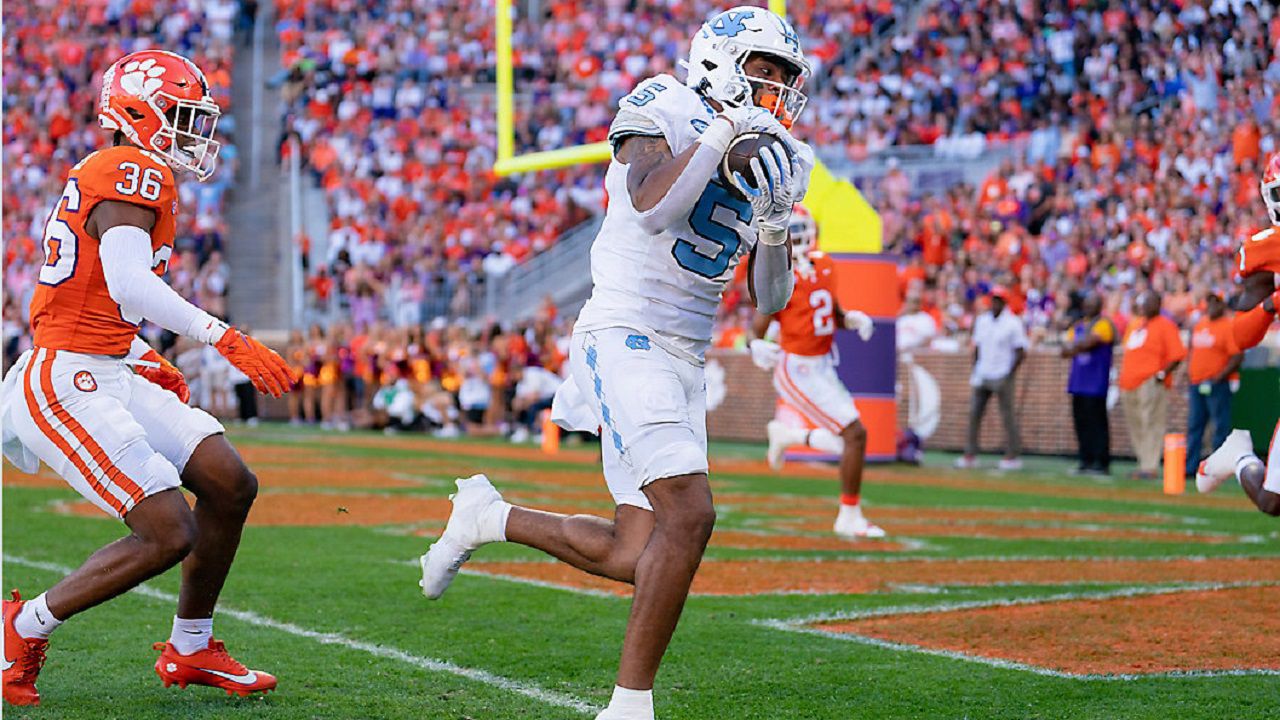 North Carolina wide receiver J.J. Jones (5) scores a touchdown during an game against Clemson Saturday, Nov. 18, 2023, in Clemson, S.C. (AP Photo/Jacob Kupferman)