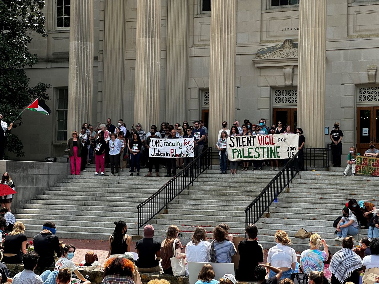 UNC faculty members show their support during a protest. (Spectrum News 1/Kyleigh Panetta)