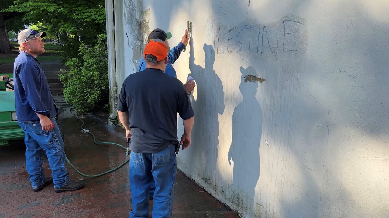 UNC officials clean up protest graffiti on campus after police disbanded the emcampment. (Spectrum News 1/Kyleigh Panetta)