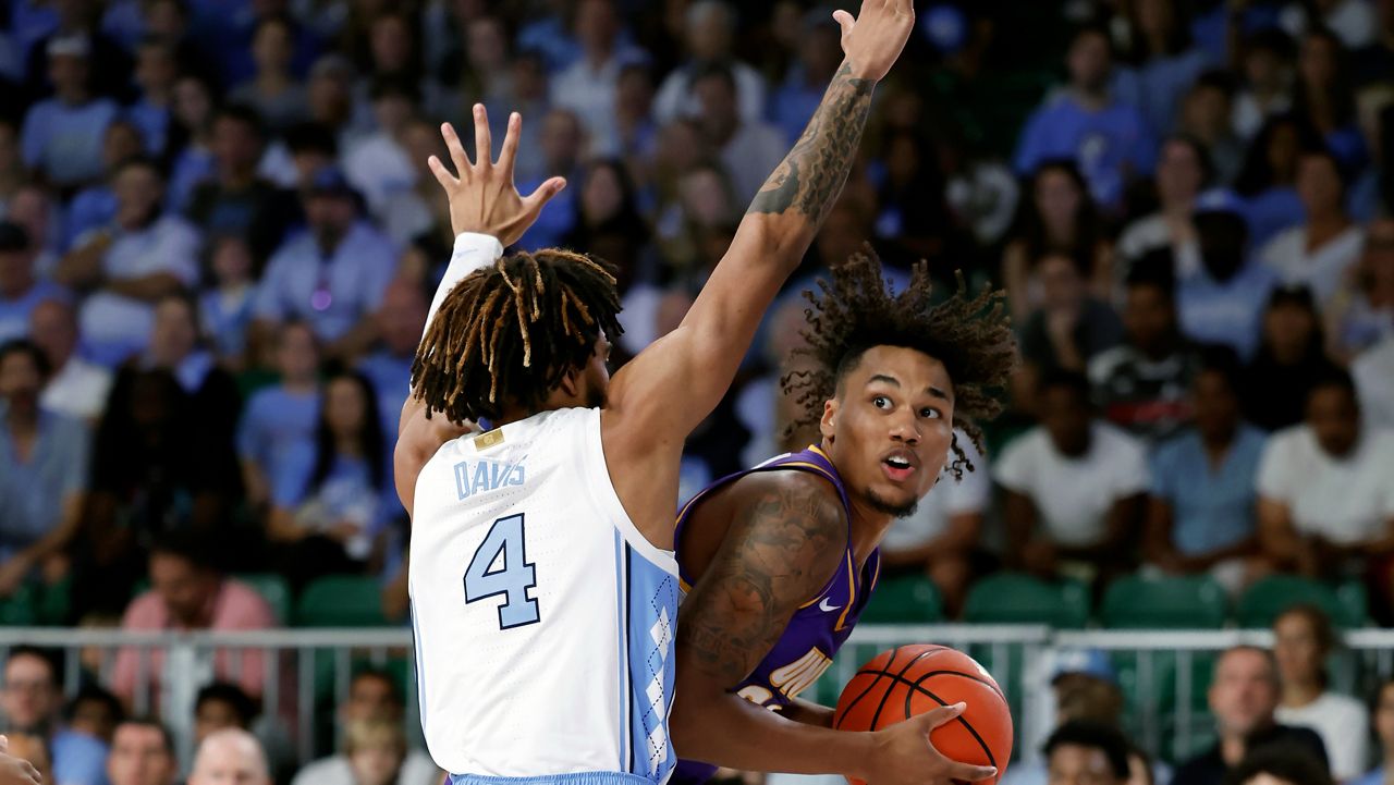 Northern Iowa's Tytan Anderson is guarded by North Carolina's RJ Davis during the Battle 4 Atlantis at Paradise Island, Bahamas, on Wednesday, Nov. 22, 2023. (Bahamas Visual Services via AP/Tim Aylen)