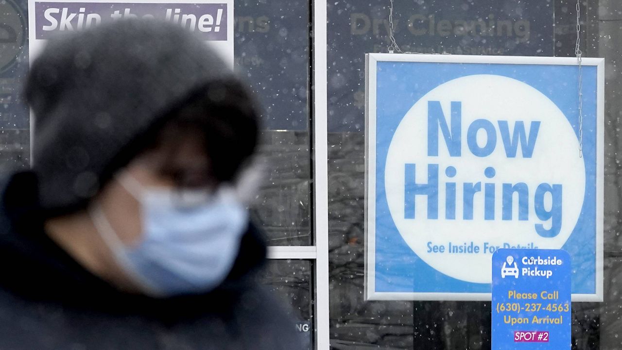 A hiring sign is displayed at a CD One Price Cleaners in Schaumburg, Ill., last month. (AP Photo/Nam Y. Huh, File)