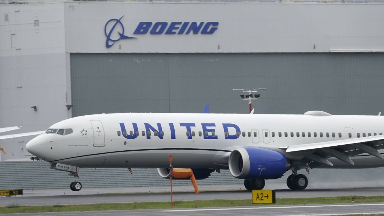 A United Airlines plane lands at King County International Airport in Seattle. (AP Photo/Ted S. Warren, File)