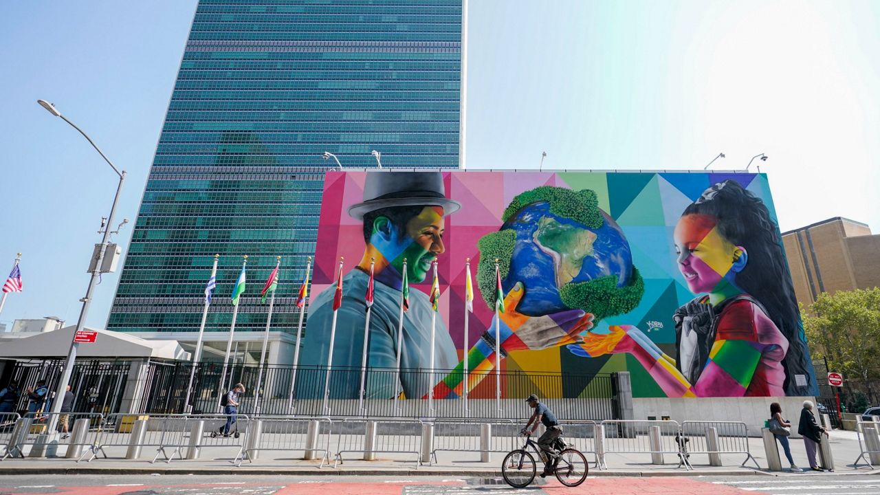 A mural by Brazilian artist Eduardo Kobra, focusing attention on climate change and stewardship of the planet, is displayed Friday outside the United Nations headquarters ahead of the General Assembly. (AP Photo/Mary Altaffer)