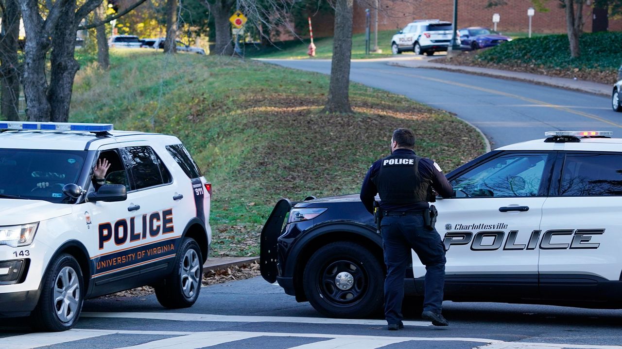 Charlottesville police secure a crime scene of an overnight shooting at the University of Virginia, Monday, Nov. 14, 2022, in Charlottesville. Va. (AP Photo/Steve Helber)