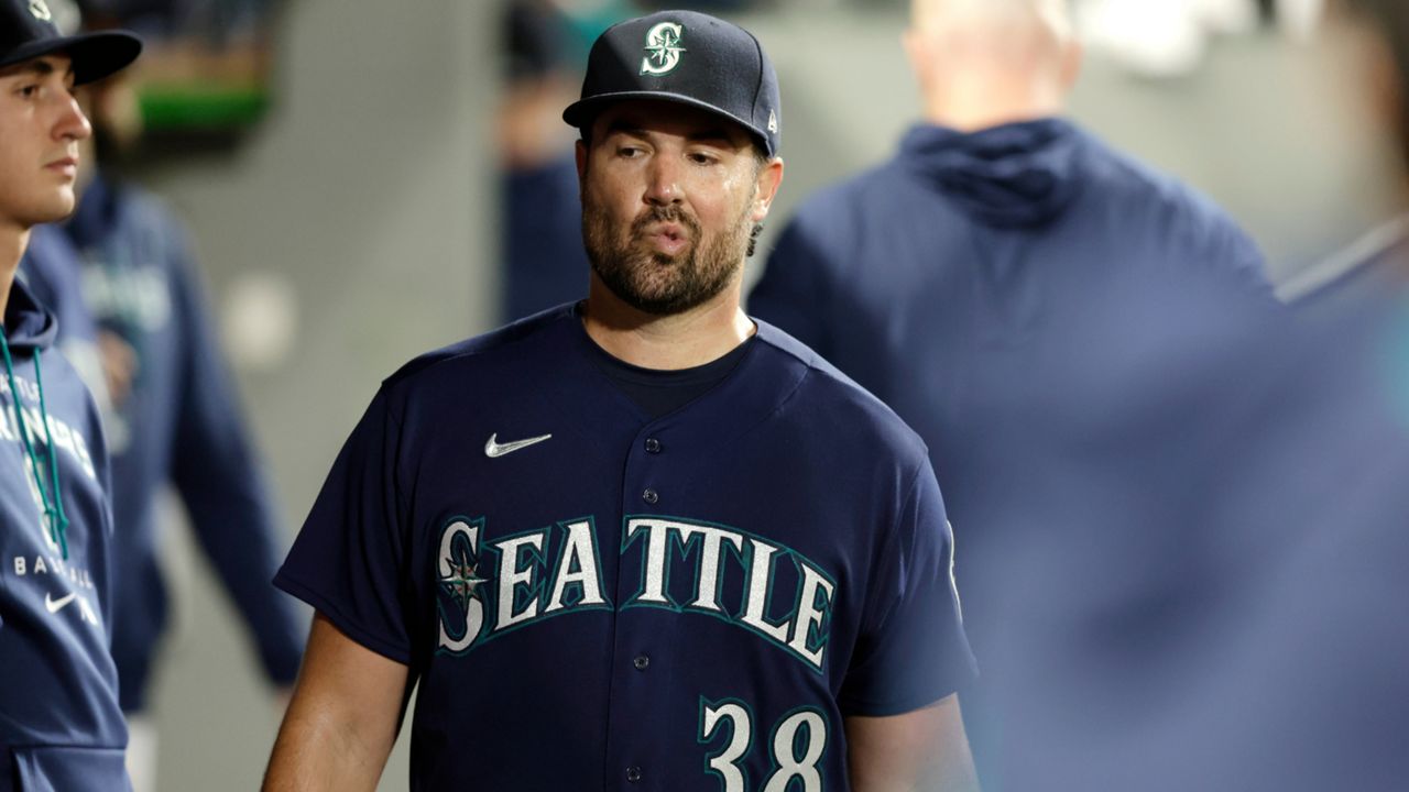 Seattle Mariners starting pitcher Robbie Raywals walks through the dugout after he was pulled from the game during the sixth inning of a baseball game against the Texas Rangers, Tuesday, Sept. 27, 2022, in Seattle. (AP Photo/John Froschauer)