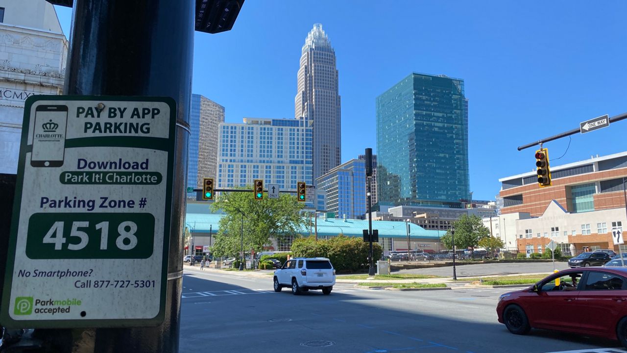 Charlotte, North Carolina - Signs in an uptown park point to other