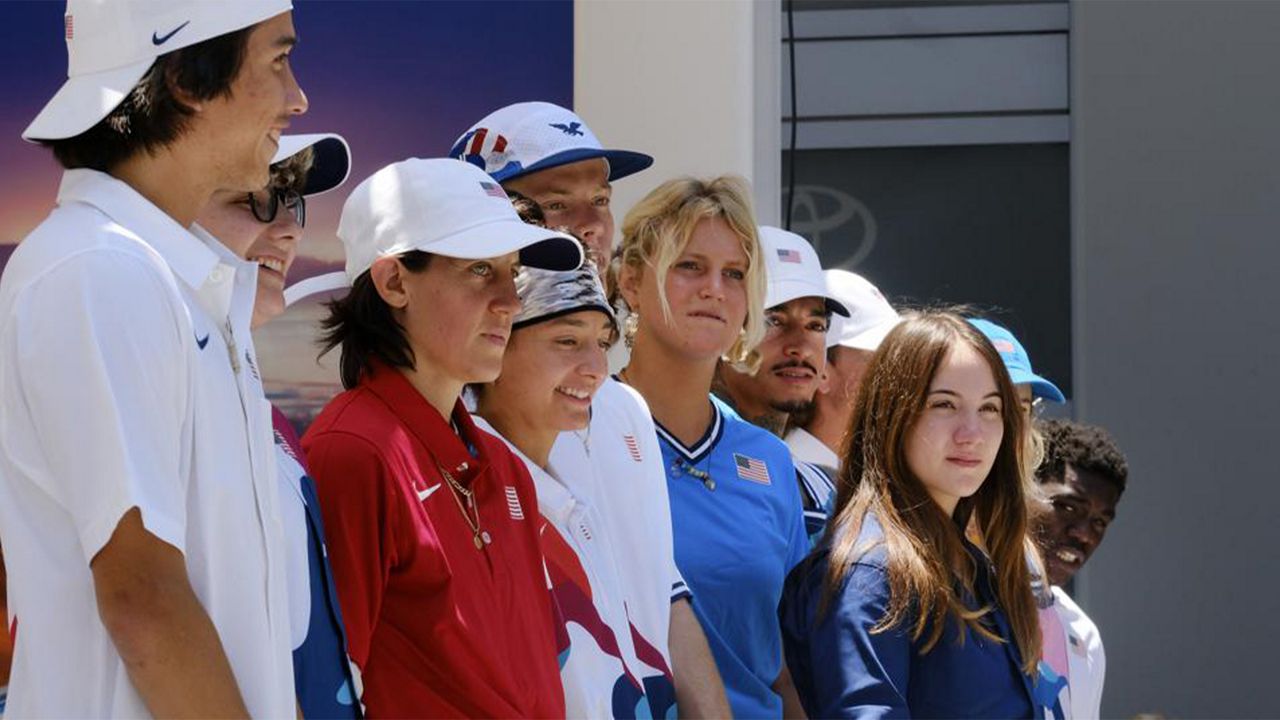 Members of the first U.S. Olympic skateboarding team stand on stage during a news conference in downtown Los Angeles on Monday, June 21, 2021. (AP Photo/Richard Vogel)