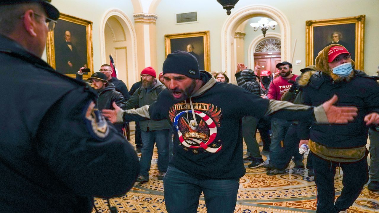Rioters in the U.S. Capitol confront police in the U.S. Capitol. (Associated Press)