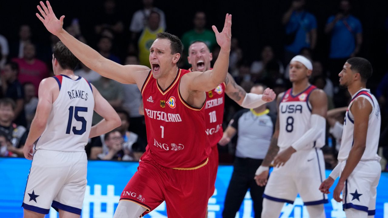 Germany center Johannes Voigtmann celebrates after winning against the United States in a Basketball World Cup semi final game in Manila, Philippines, Friday, Sept. 8, 2023. (AP Photo/Michael Conroy)