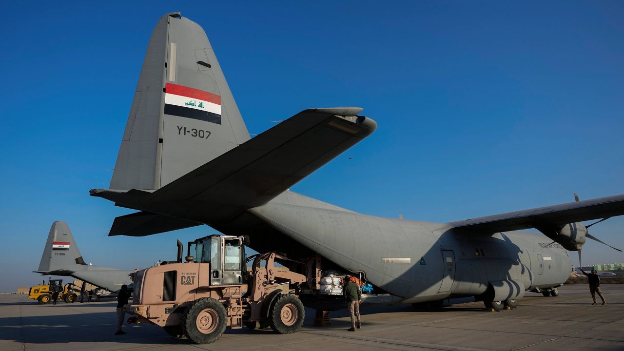 Iraqi security forces prepare for loading humanitarian aid from Red Crescent for Palestinians in Gaza, before its departure from a military airbase near Baghdad International Airport in Baghdad, Iraq, Jan. 24, 2024. (AP Photo/Hadi Mizban, File)