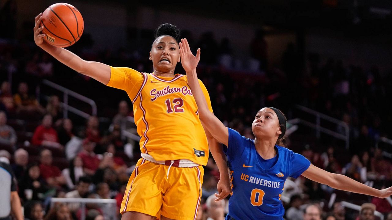 Southern California guard JuJu Watkins, left, shoots as UC Riverside guard Makayla Jackson defends during the first half of an NCAA college basketball game, Dec. 10, 2023, in Los Angeles. (AP Photo/Mark J. Terrill)