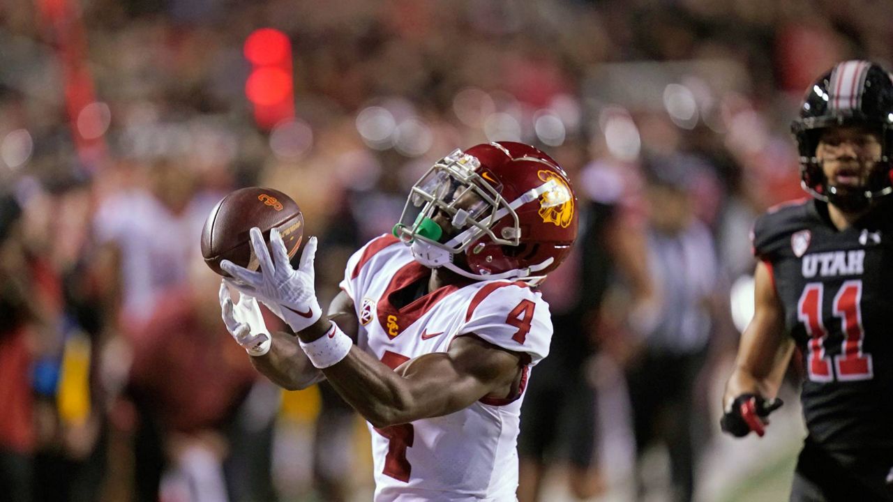 Southern California's Mario Williams catches as pass next to Utah safety R.J. Hubert (11) during the first half of an NCAA college football game Saturday in Salt Lake City. (AP Photo/Rick Bowmer)