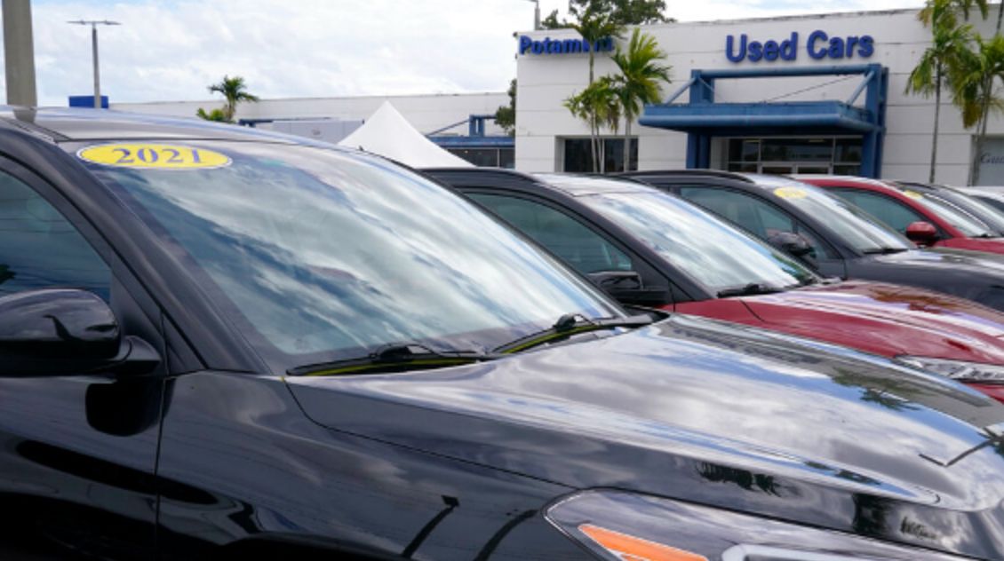 A line of cars are for sale at the Potamkin Hyundai dealership used car lot, Tuesday, Feb. 1, 2022, in Miami Lakes, Fla. U.S. new vehicle sales were expected to tumble more than 20% in the second quarter compared with a year ago as the global semiconductor shortage continued to vex the industry. Yet demand continued to outstrip supply from April through June 2022, even with $5 per gallon gasoline, rampant inflation and rising interest rates. (AP Photo/Marta Lavandier)