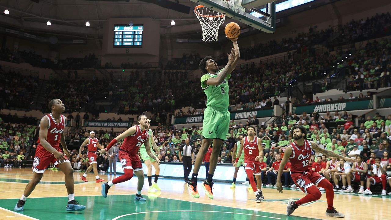 South Florida guard Brandon Stroud shoots against the Florida Atlantic during the first half of an NCAA college basketball game Sunday, Feb.18, 2024 in Tampa, Fla. (AP Photo/Scott Audette)