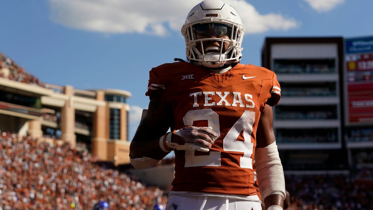 Texas running back Jonathon Brooks (24) celebrates as he scores on a touchdown run against Kansas during the second half of an NCAA college football game in Austin, Texas, Saturday, Sept. 30, 2023. (AP Photo/Eric Gay)