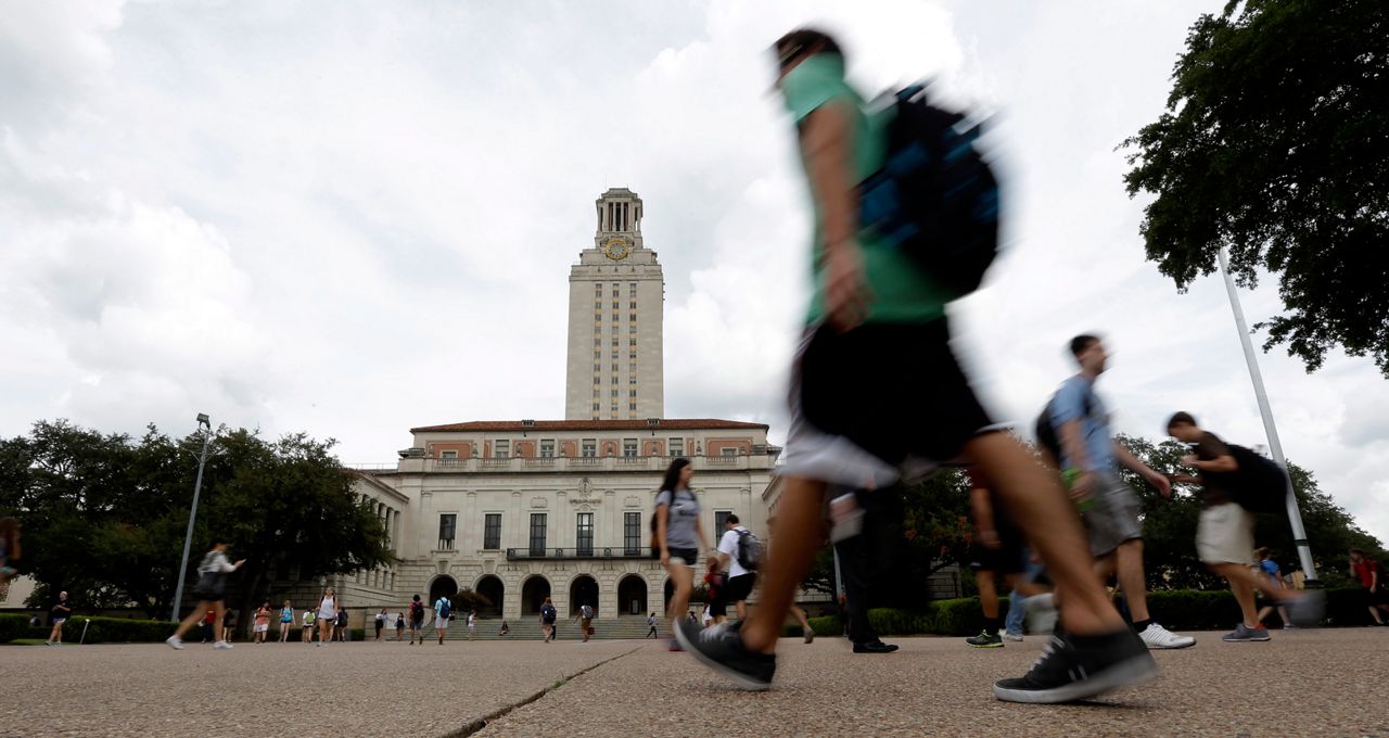 Students walking past UT's iconic tower in Austin on Sept. 27, 2012. (AP Photo/Eric Gay)
