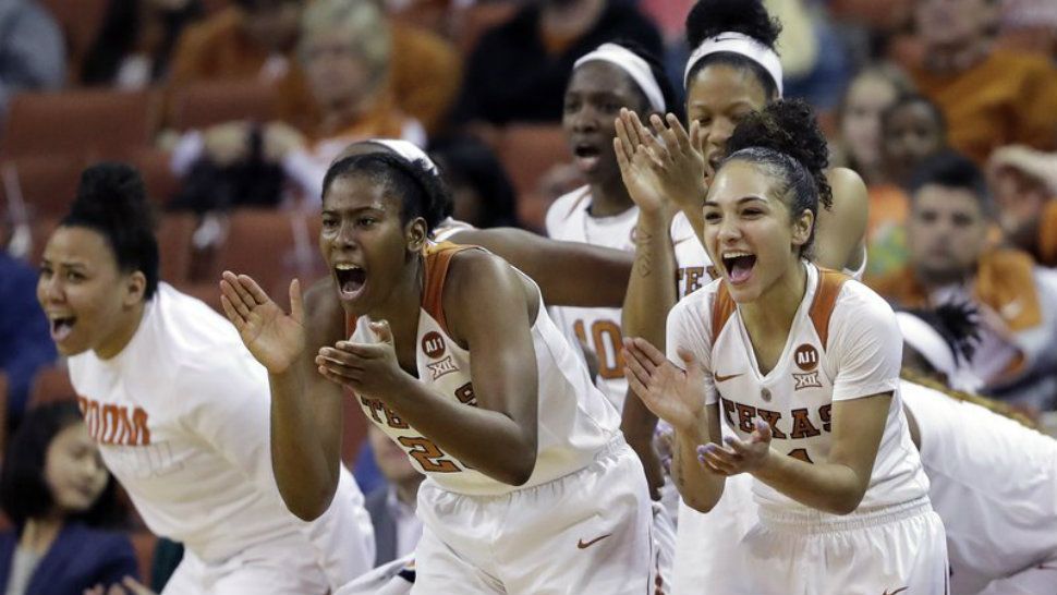 In this Feb. 10, 2018 photo, Texas guard Brooke McCarty, right, guard Ariel Atkins, center, and teammates celebrate from the bench during the second half of an NCAA college basketball game against Kansas State, in Austin, Texas. (AP Photo/Eric Gay, File)