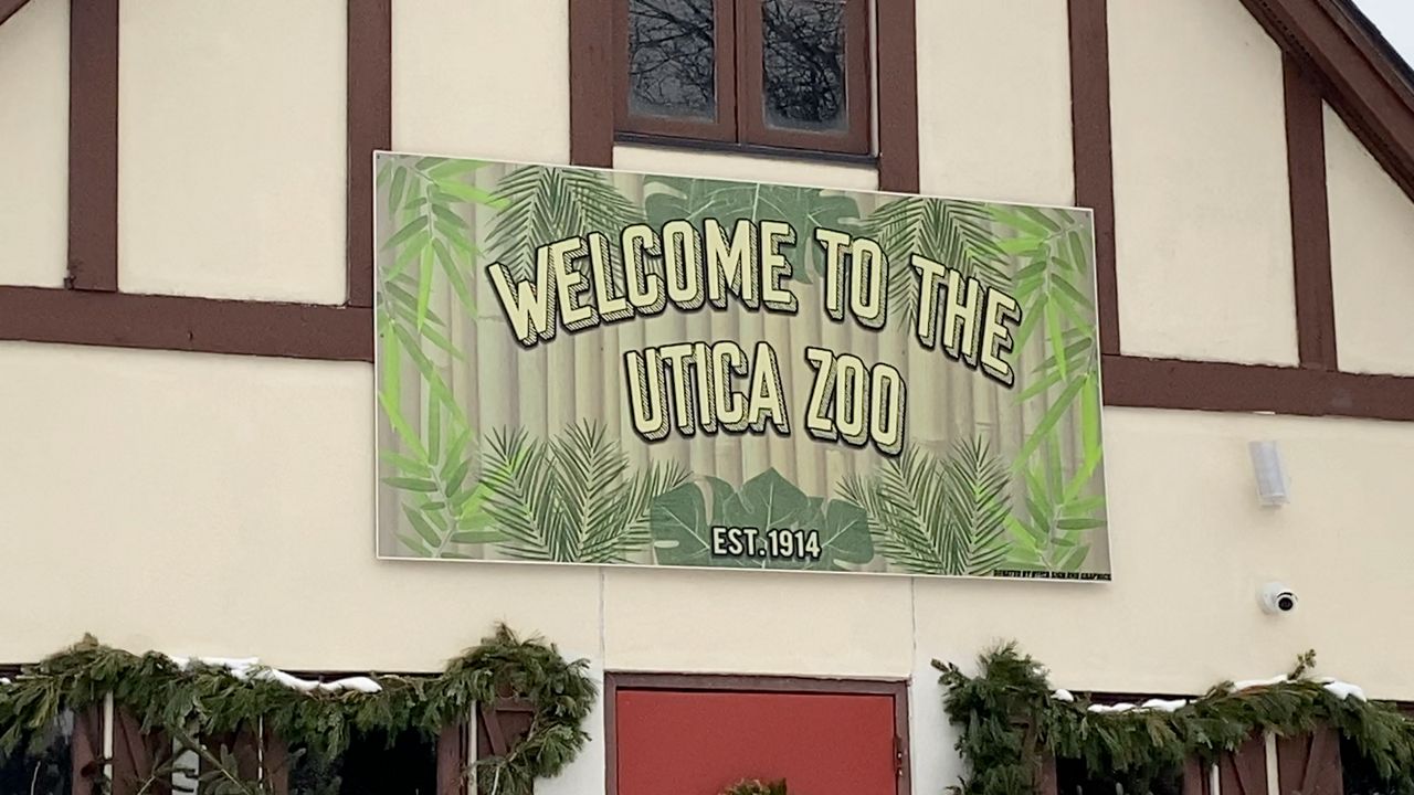 utica zoo sign hanging over entrance