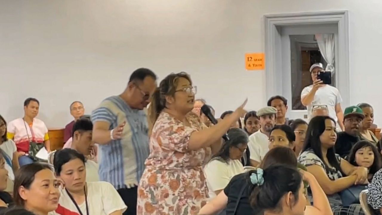 utica woman points at mayor during comments