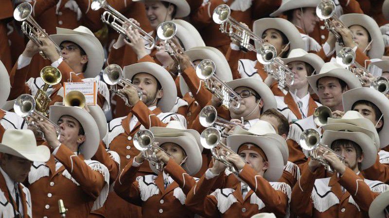 FILE - In this Saturday, Sept. 4, 2010 file photo, Members of the University of Texas Longhorn Band perform during the NCAA football game against Rice in Houston. (AP Photo/Pat Sullivan, File)