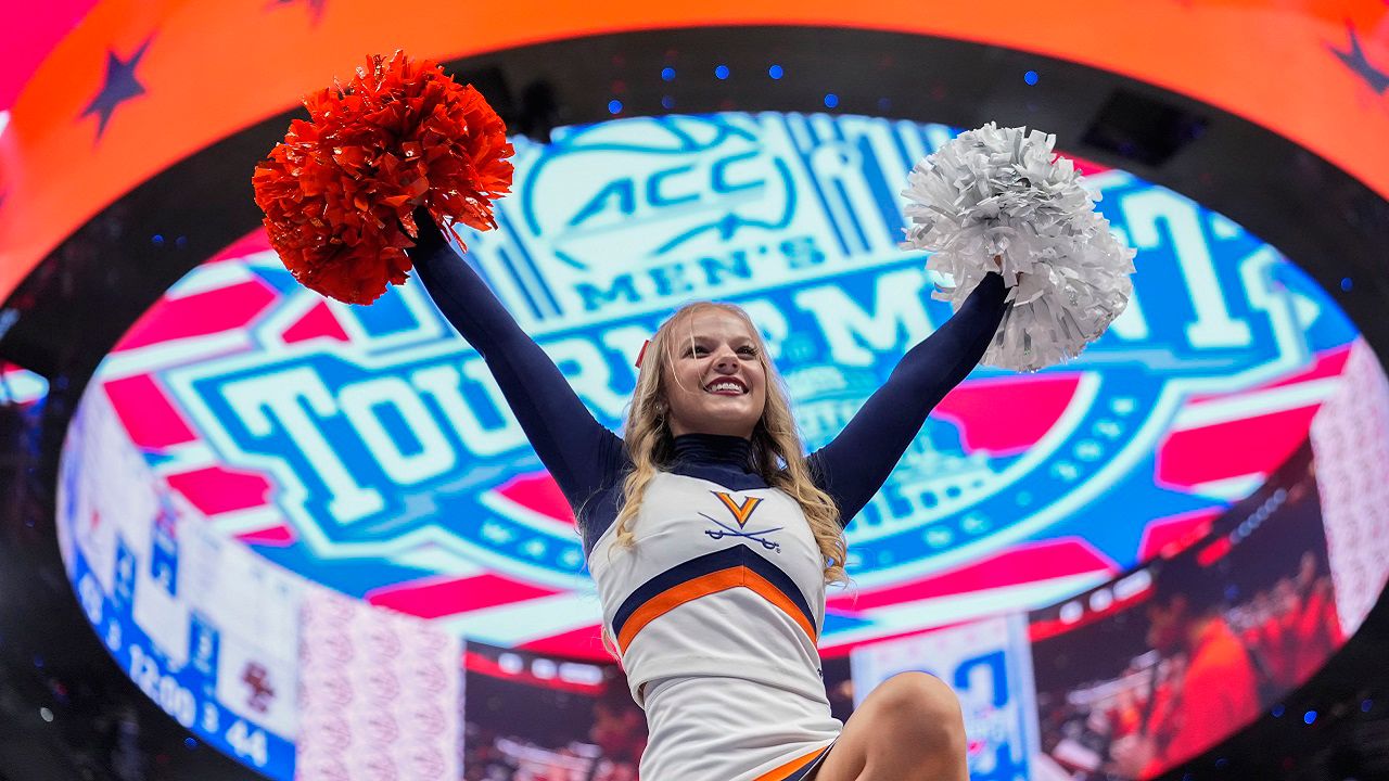 A cheerleader for Virginia is lifted upward during the second half of an NCAA college basketball game between Virginia and Boston College in the quarterfinal round of the Atlantic Coast Conference tournament Thursday, March 14, 2024, in Washington. (AP Photo/Alex Brandon)