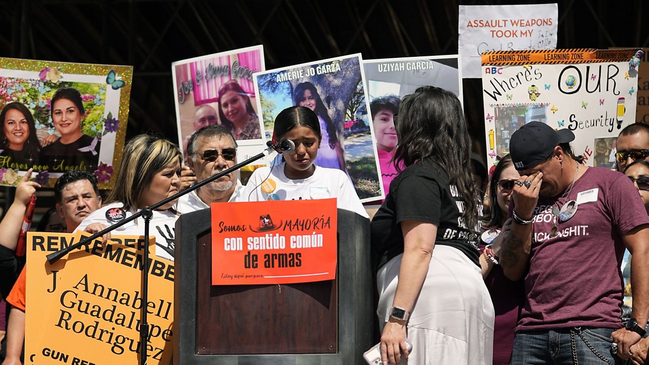 Robb Elementary school shooting survivor Caitlyne Gonzales, center, tries to hold back tears as she speaks to other advocates for control gathered at the Texas Capitol to call on Texas lawmakers to strengthen Texas' gun laws, in Austin, Texas, Tuesday, Feb. 28, 2023. (AP Photo/Eric Gay)