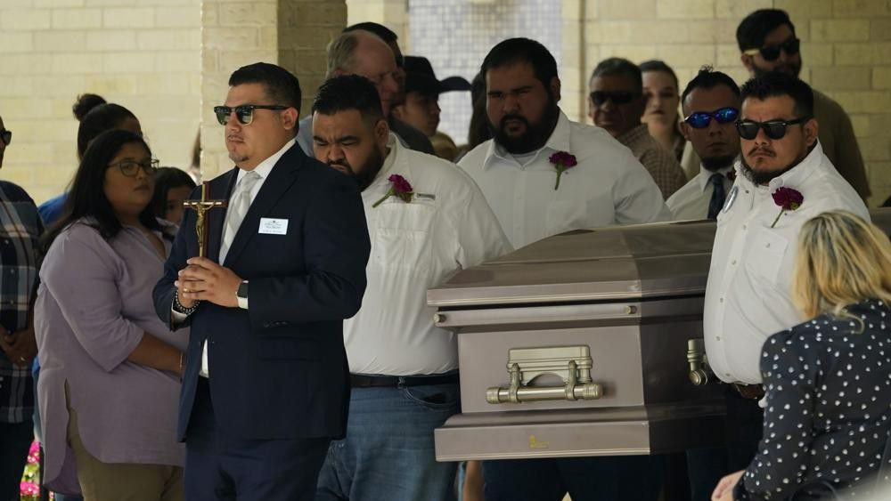 Pallbearers carry the casket of Amerie Jo Garza following funeral services at Sacred Heart Catholic Church, Tuesday, May 31, 2022, in Uvalde, Texas. Garza was killed in last week's elementary school shooting, (AP Photo/Eric Gay)