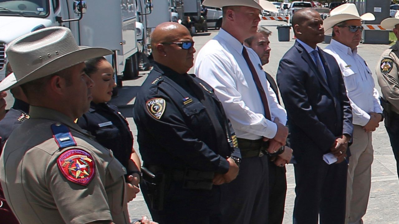 In this May 26, 2022, photo, Uvalde School Police Chief Pete Arredondo, third from left, stands during a news conference outside of the Robb Elementary school in Uvalde, Texas. Facing massive public pressure, Uvalde’s top school official has recommended the firing of the school district police chief who was central to the botched law enforcement response to the shooting at an elementary school that killed two teachers and 19 students.The city’s school board will consider firing Arrendondo at a special meeting Saturday, July 23, to consider the superintendent's recommendation. (AP Photo/Dario Lopez-Mills)