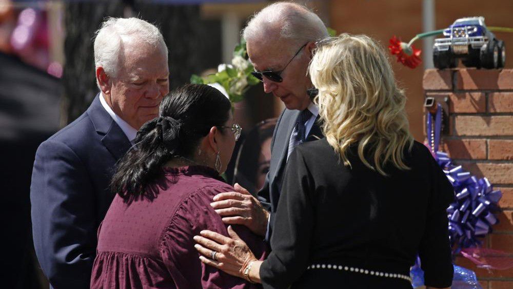 President Joe Biden and first lady Jill Biden comfort principal Mandy Gutierrez as superintendent Hal Harrell stands next to them, at the memorial outside Robb Elementary School to honor the victims killed in this week's school shooting in Uvalde, Texas, on May 29, 2022. The attorney for the principal of the Texas elementary school where a gunman killed 19 students and two teachers says Gutierrez has been placed on administrative leave on Monday, July 25. (AP Photo/Dario Lopez-Mills, File)