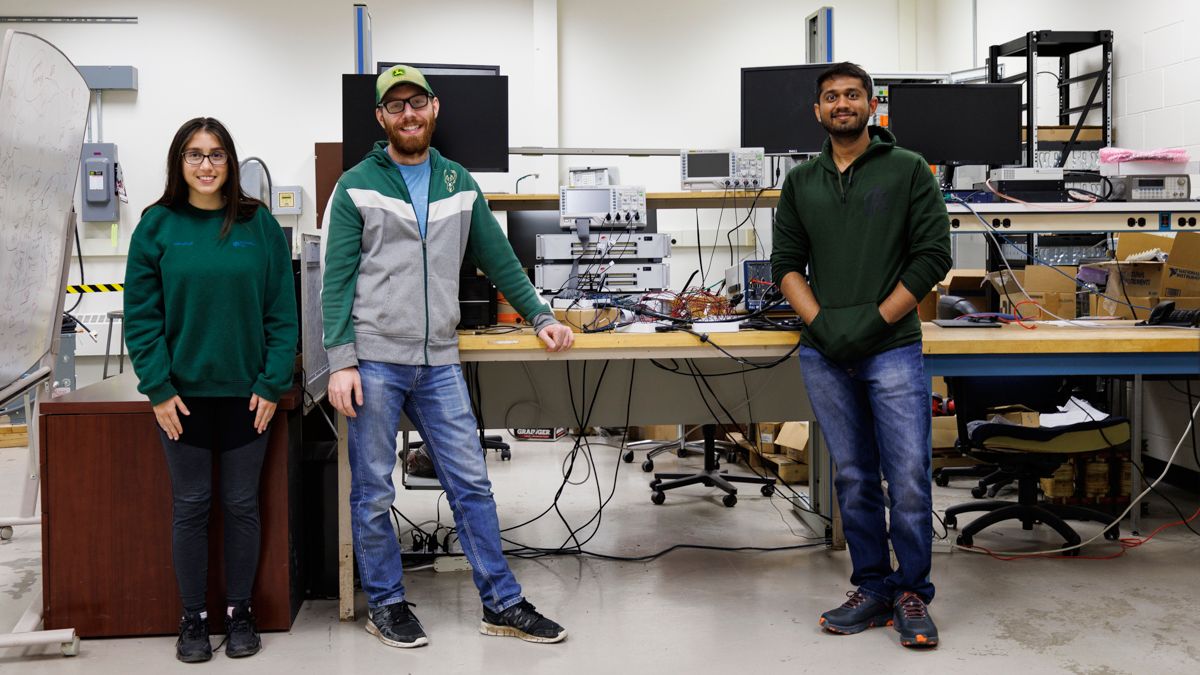 Sonia Bendre, Joe Lentz and Allen Gee Jacob stand by electrical testing equipment. (Spectrum News 1/John Clark)