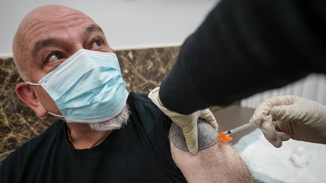 A man receives the Johnson & Johnson COVID-19 vaccine in the Staten Island borough of New York on April 8. (AP Photo/Mary Altaffer)