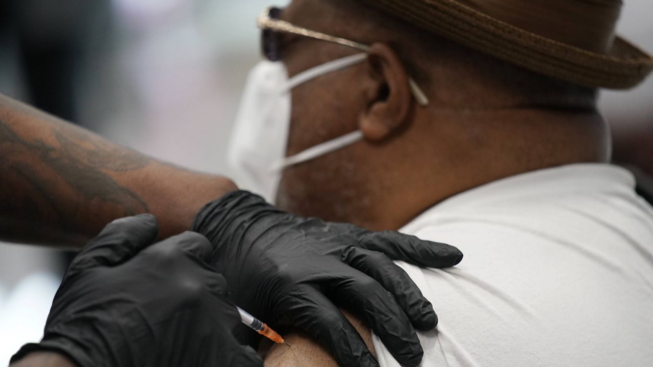 In this Feb. 10, 2021, file photo, a man receives a COVID-19 vaccine in North Las Vegas, Nevada. (AP Photo/John Locher, File)