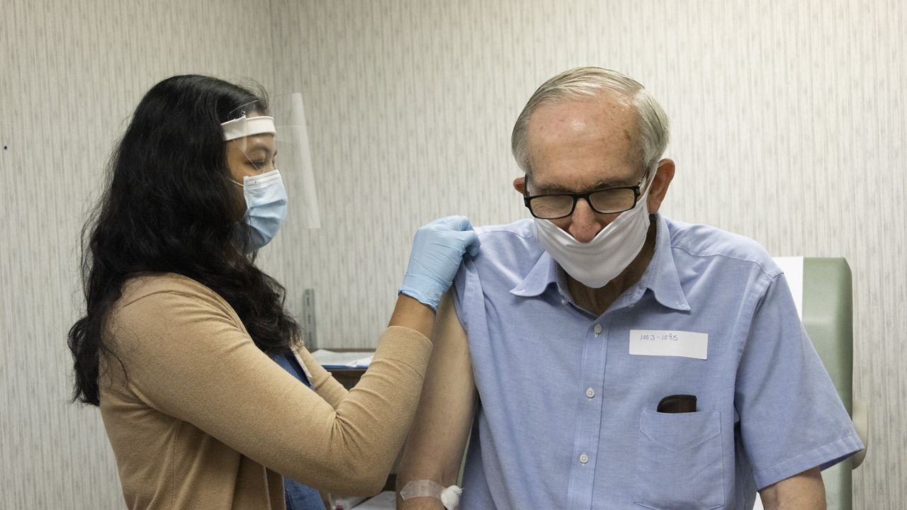 A man receives a vaccine injection in this file image. (Spectrum News/FILE)