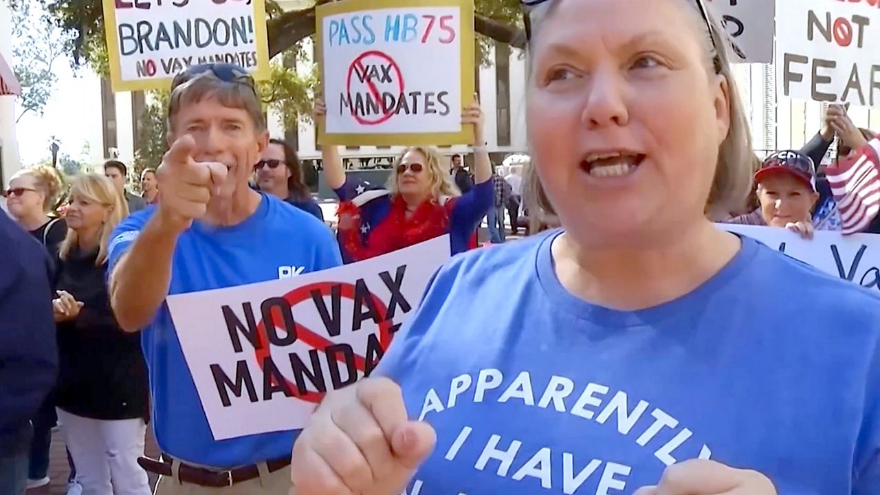 Critics rally against COVID-19 vaccination mandates outside the Florida Capitol Wednesday. (Spectrum News)