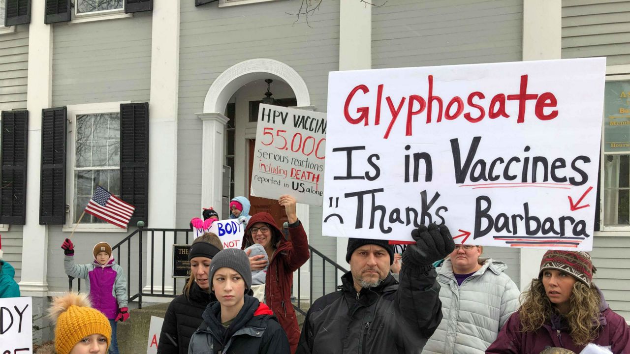 Protesters outside of Assemblywoman Barbara Lifton's office against mandatory vaccines.