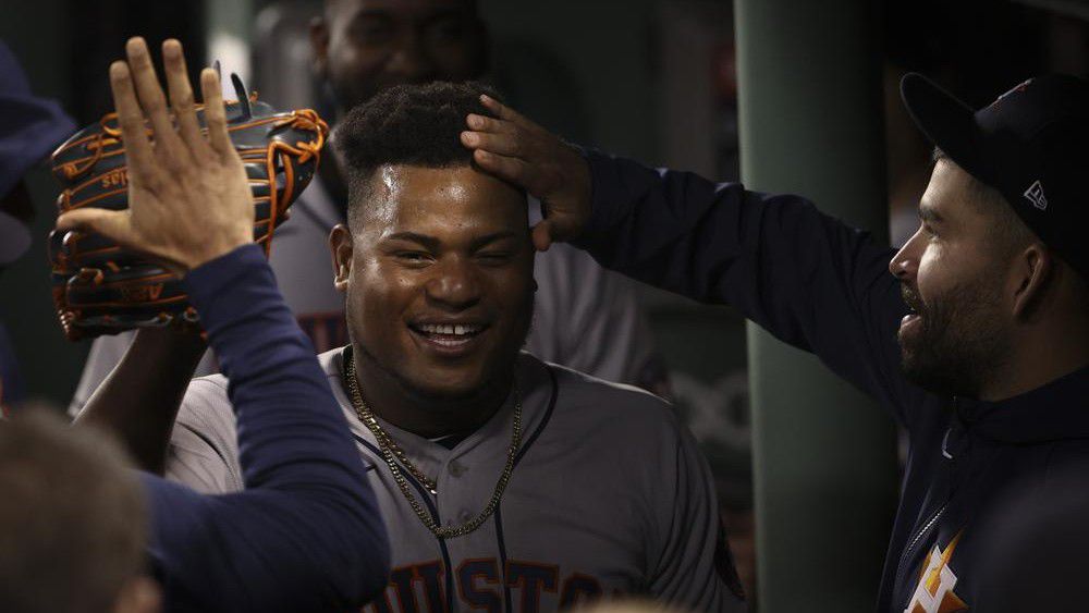 Houston Astros starting pitcher Framber Valdez celebrates in the dugout after the eighth inning in Game 5 of baseball's American League Championship Series against the Boston Red Sox Wednesday, Oct. 20, 2021, in Boston. (AP Photo/Winslow Townson)