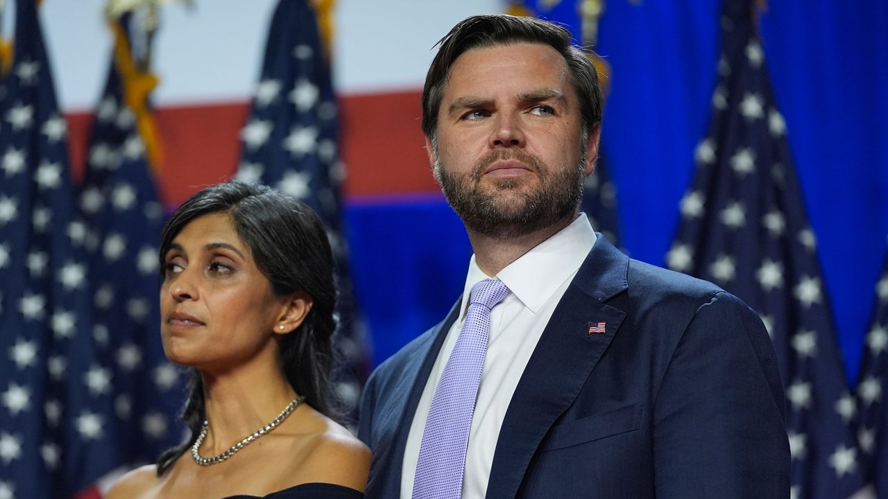 Republican vice presidential nominee Sen. JD Vance, R-Ohio, and his wife Usha Vance listen as Republican presidential nominee former President Donald Trump attends an election night watch party at the Palm Beach Convention Center, Wednesday, Nov. 6, 2024, in West Palm Beach, Fla. (AP Photo/Evan Vucci)