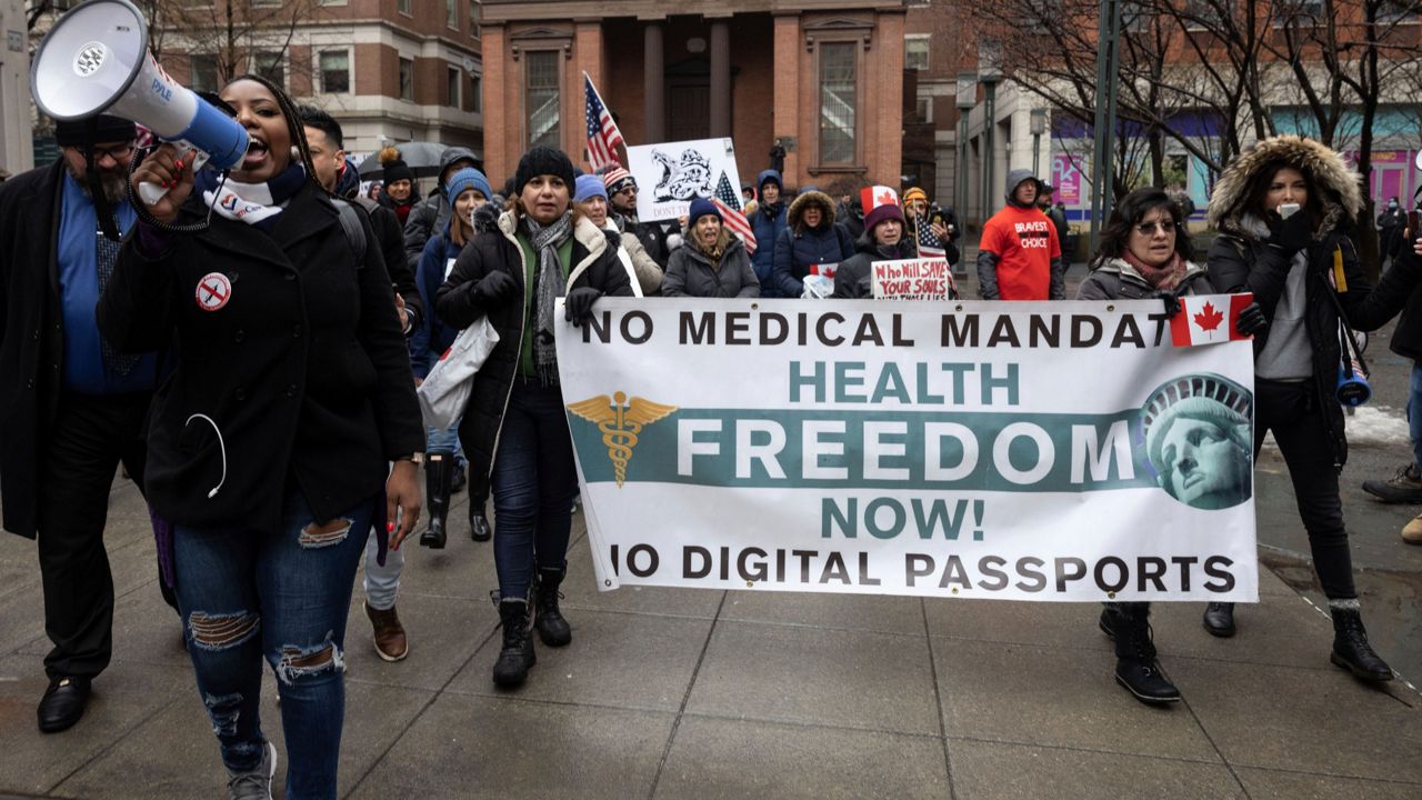 People march to Brooklyn Bridge during an anti-vaccine mandate protest ahead of the termination of New York City employees due who have not been vaccinated, Monday, Feb. 7, 2022. (AP Photo/Yuki Iwamura)