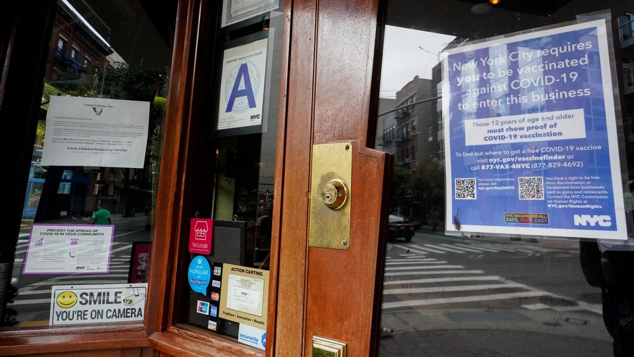 The city's requirement that diners show proof of vaccination to eat in restaurants is ending Monday. (AP Photo/Mary Altaffer)