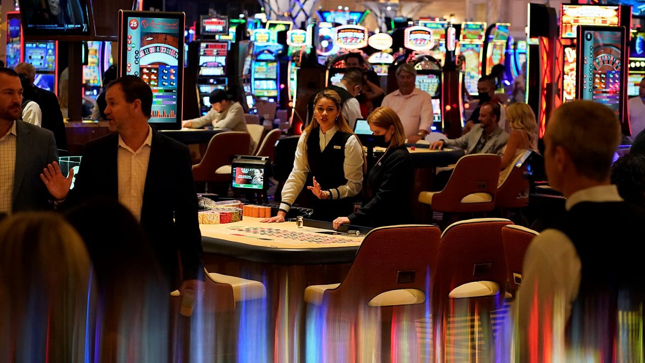 In this June 2021 photo, crowds walk through the casino during the opening night of Resorts World Las Vegas in Las Vegas. (AP/John Locher)