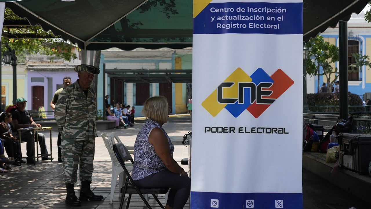 A person registers to vote in the presidential election in Caracas, Venezuela, Tuesday, April 16, 2024. Voters go to the polls on July 28th. (AP Photo/Ariana Cubillos)