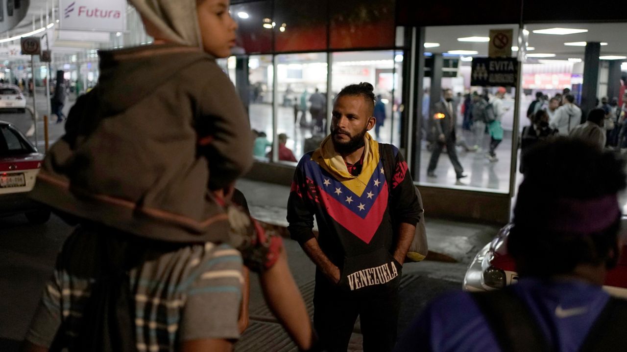 Venezuelan migrants wait for a bus to take them north, at the Northern Bus Station in Mexico City, Oct. 13, 2022. President Joe Biden last week invoked a Trump-era rule known as Title 42, which Biden's own Justice Department is fighting in court, to deny Venezuelans fleeing their crisis-torn country the chance to request asylum at the border. The rule, first invoked by Trump in 2020, uses emergency public health authority to allow the United States to keep migrants from seeking asylum at the border, based on the need to help prevent the spread of COVID-19. (AP Photo/Eduardo Verdugo, File)